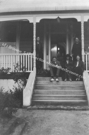 GROUP OF 5 PEOPLE ON VERANDAH